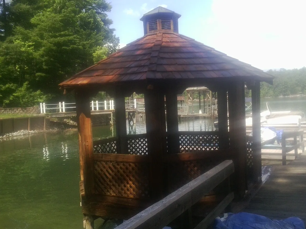 Cedar shake gazebo roof rebuilt on a lake dock in South Bound Brook